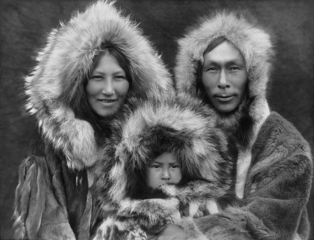A family photo of an Inupiat mother, father, and son, photographed in Noatak, Alaska, by Edward Sheriff Curtis circa 1929.