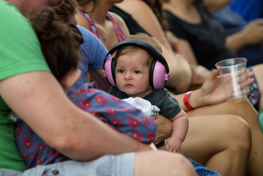 A baby listening with headphones