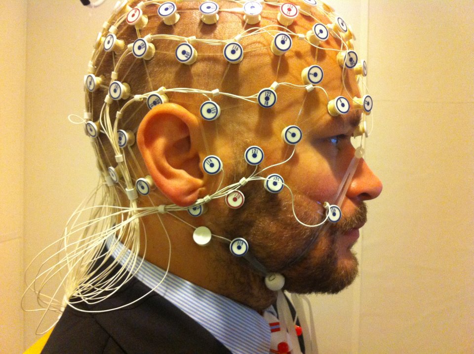 A photo of a man ready for electroencephalogram (EEG) recording.