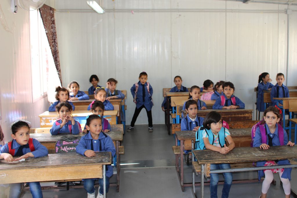A classroom with lots of children