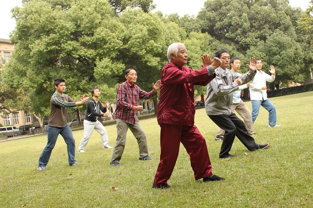 A group of people practicing tai chi