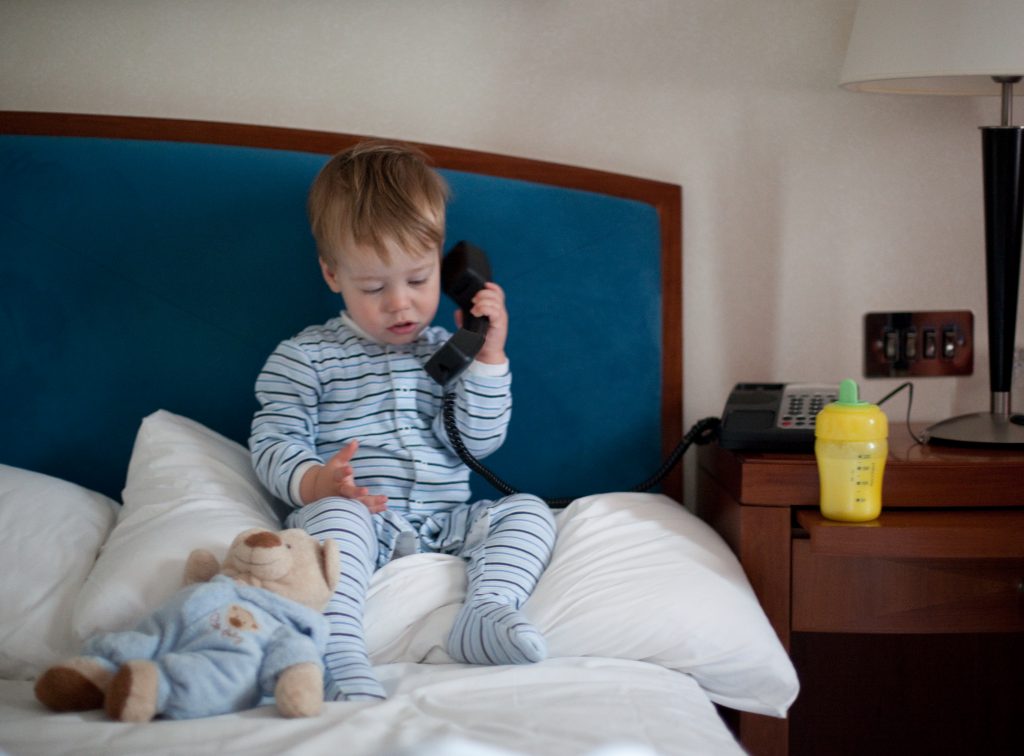 A child using a toy telephone