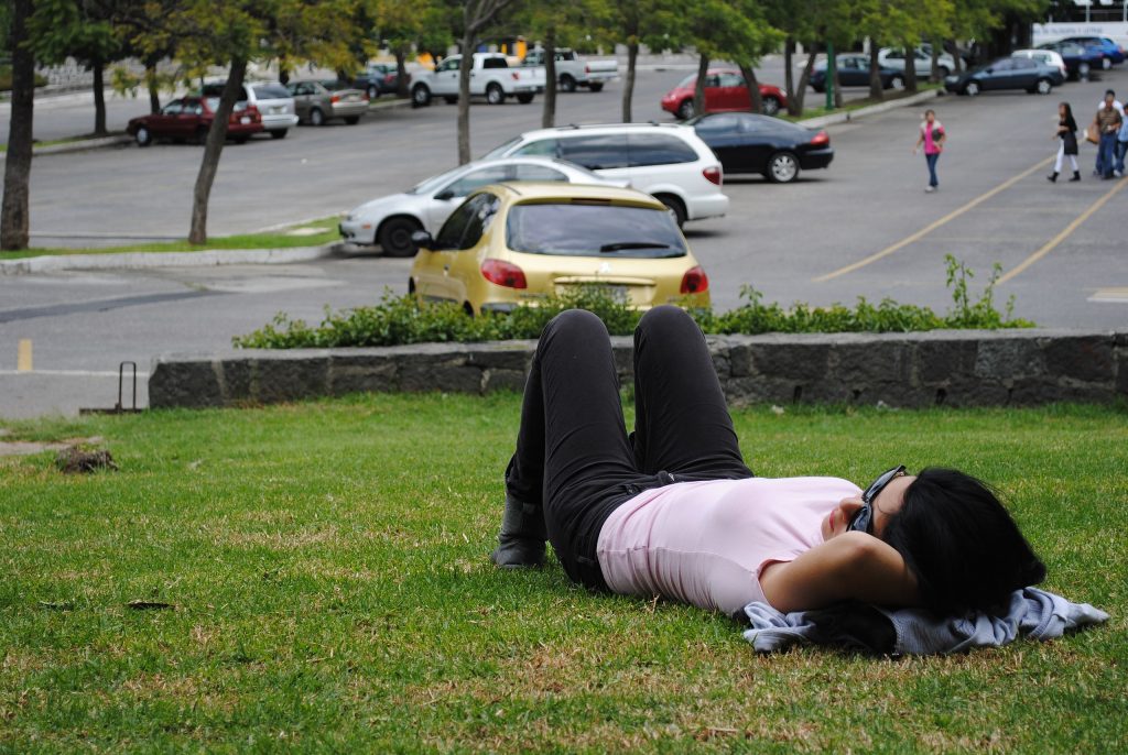 A girl sleeping in a park
