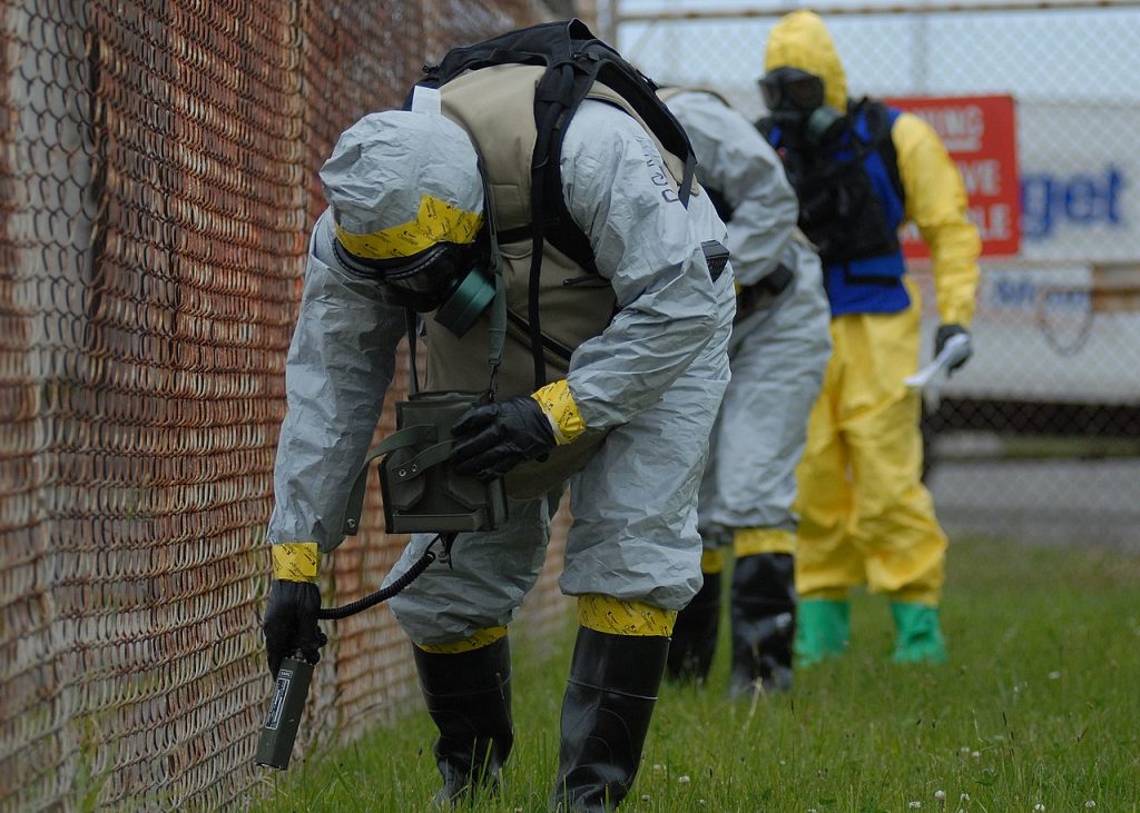 A man spraying hazardous chemicals