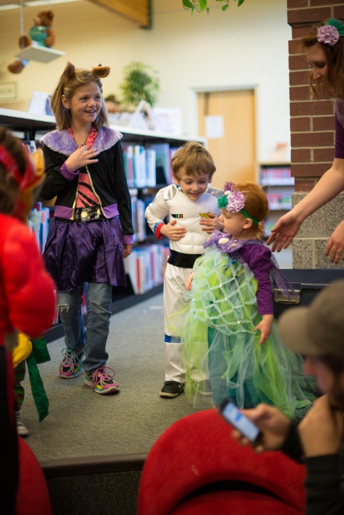 Girls and boys dressed in gendered clothing for Halloween