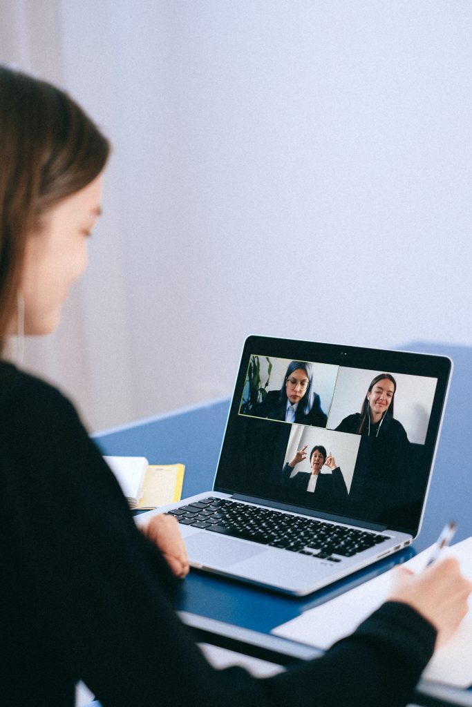People interacting on a video call.