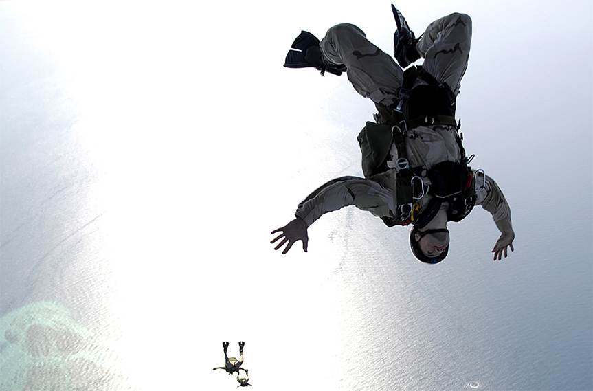 Two skydivers free falling in the sky.
