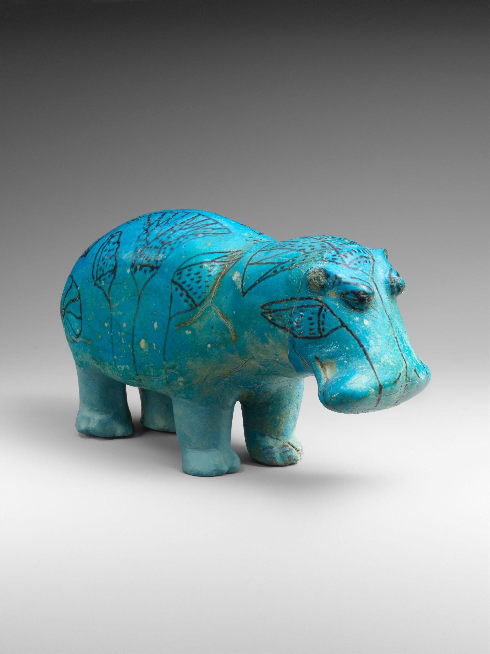 A turquoise marble stone hippo statue.