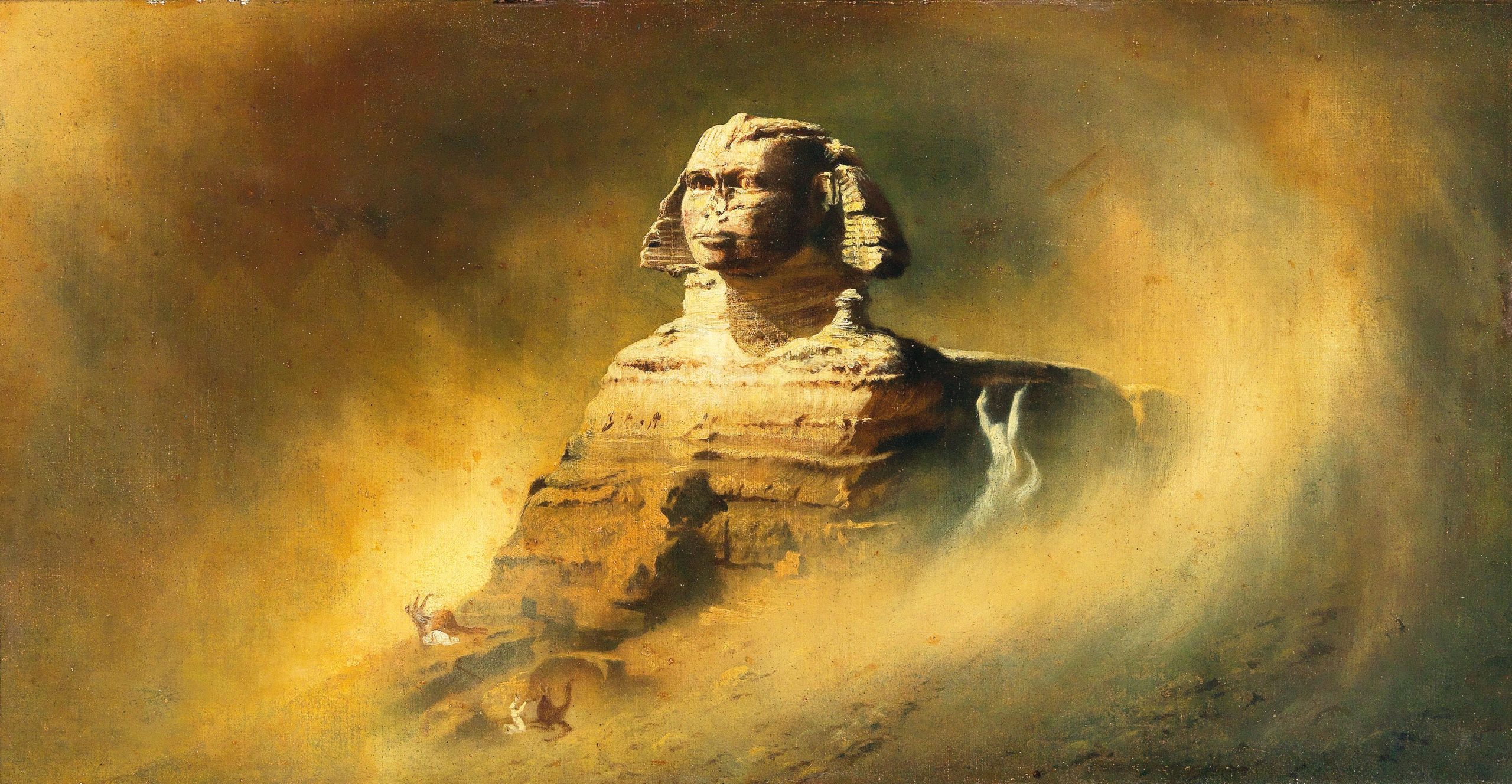 A sphinx sits in the desert.