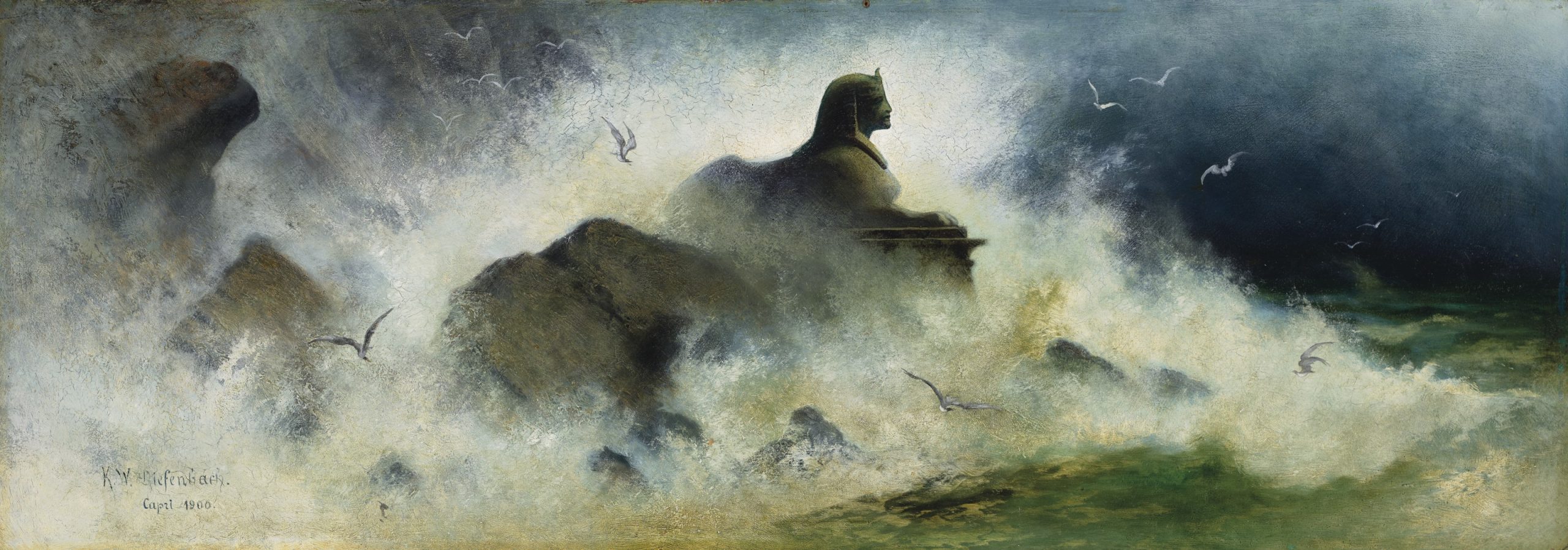 A sphinx looks towards a windy sea while birds fly around the water and rocks.