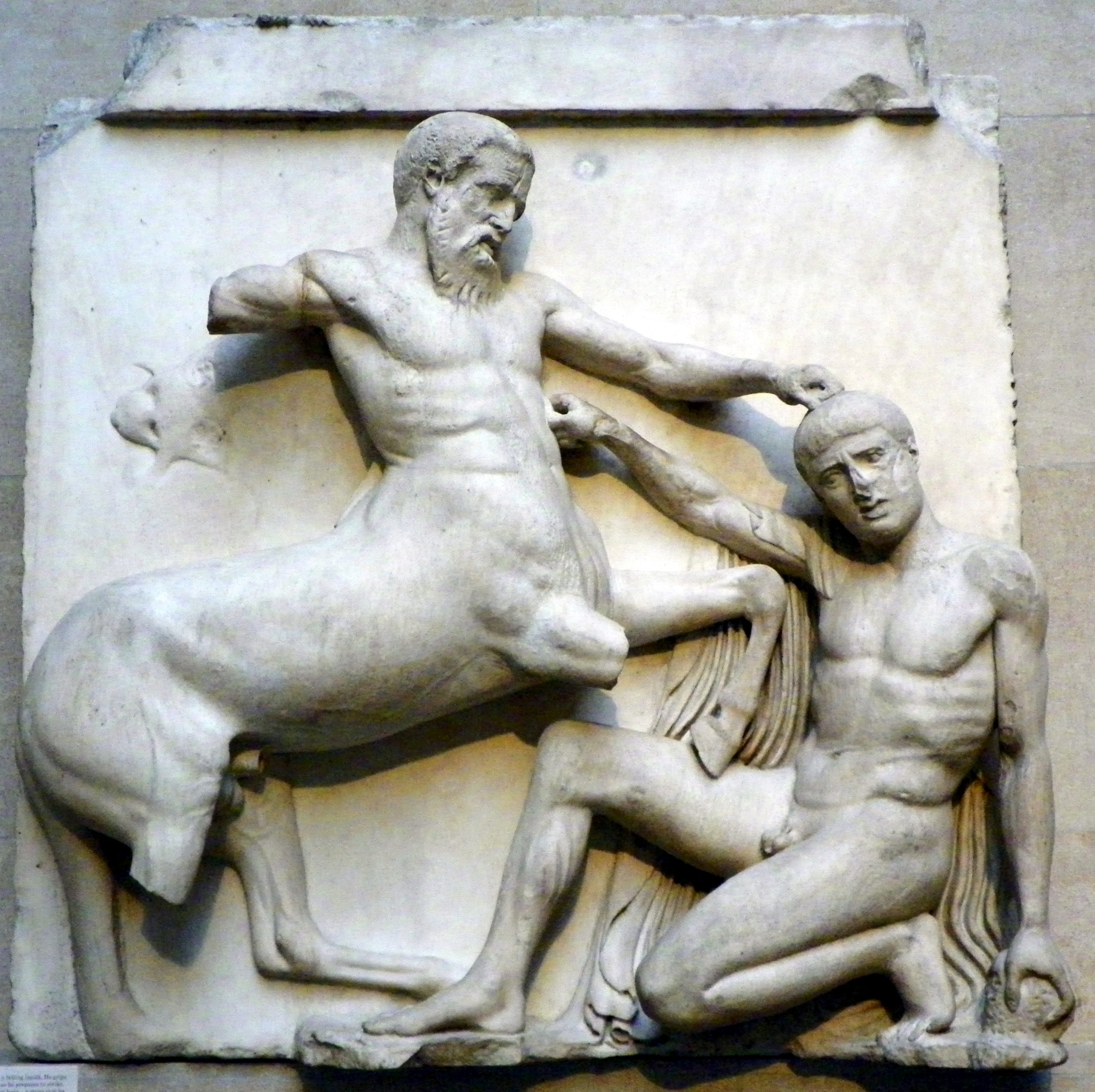 A sculpture detailing a fight between a centaur and a man.