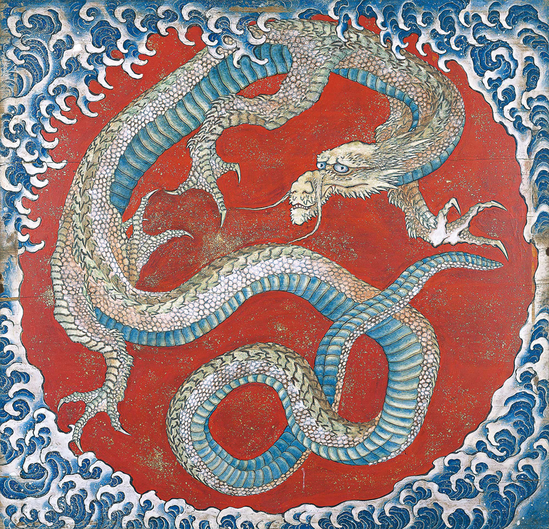 A large dragon stares towards the viewer within a circle of waves.