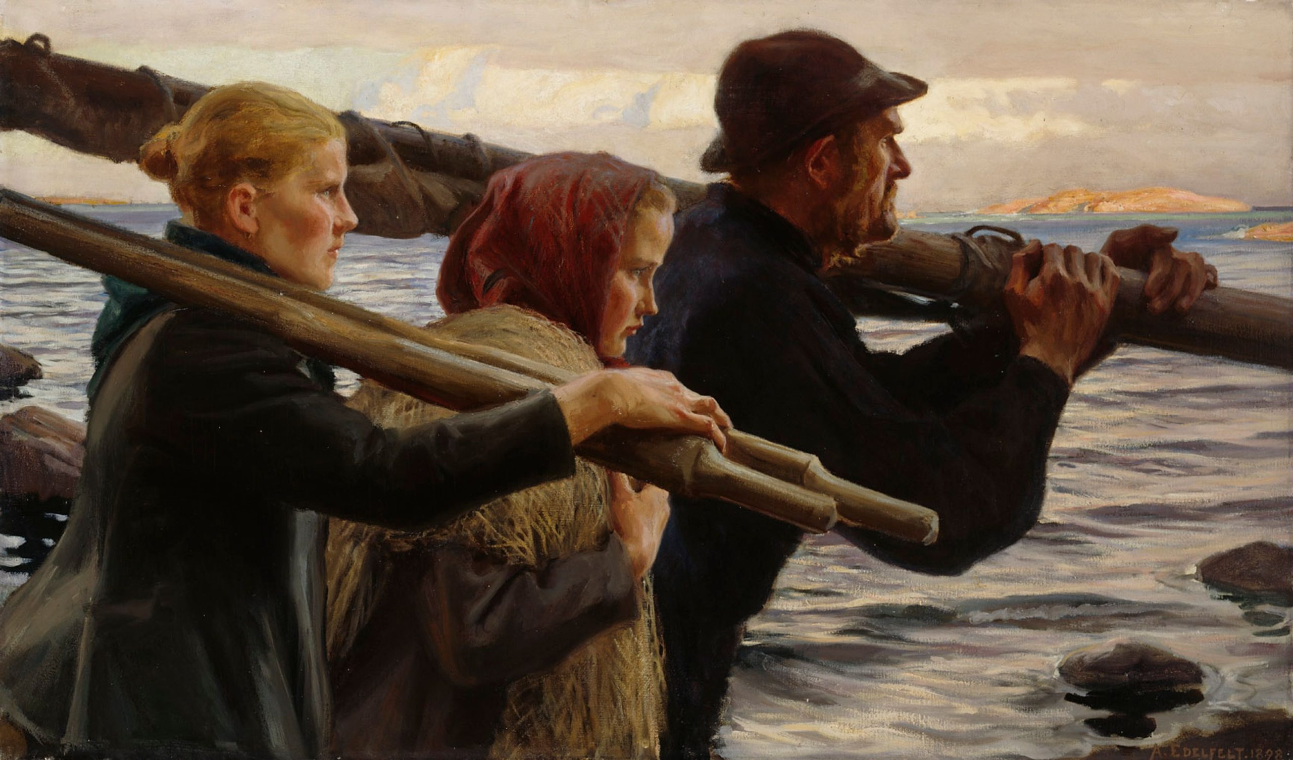 A man and two girls carrying wooden parts of a sailboat looking out at sea
