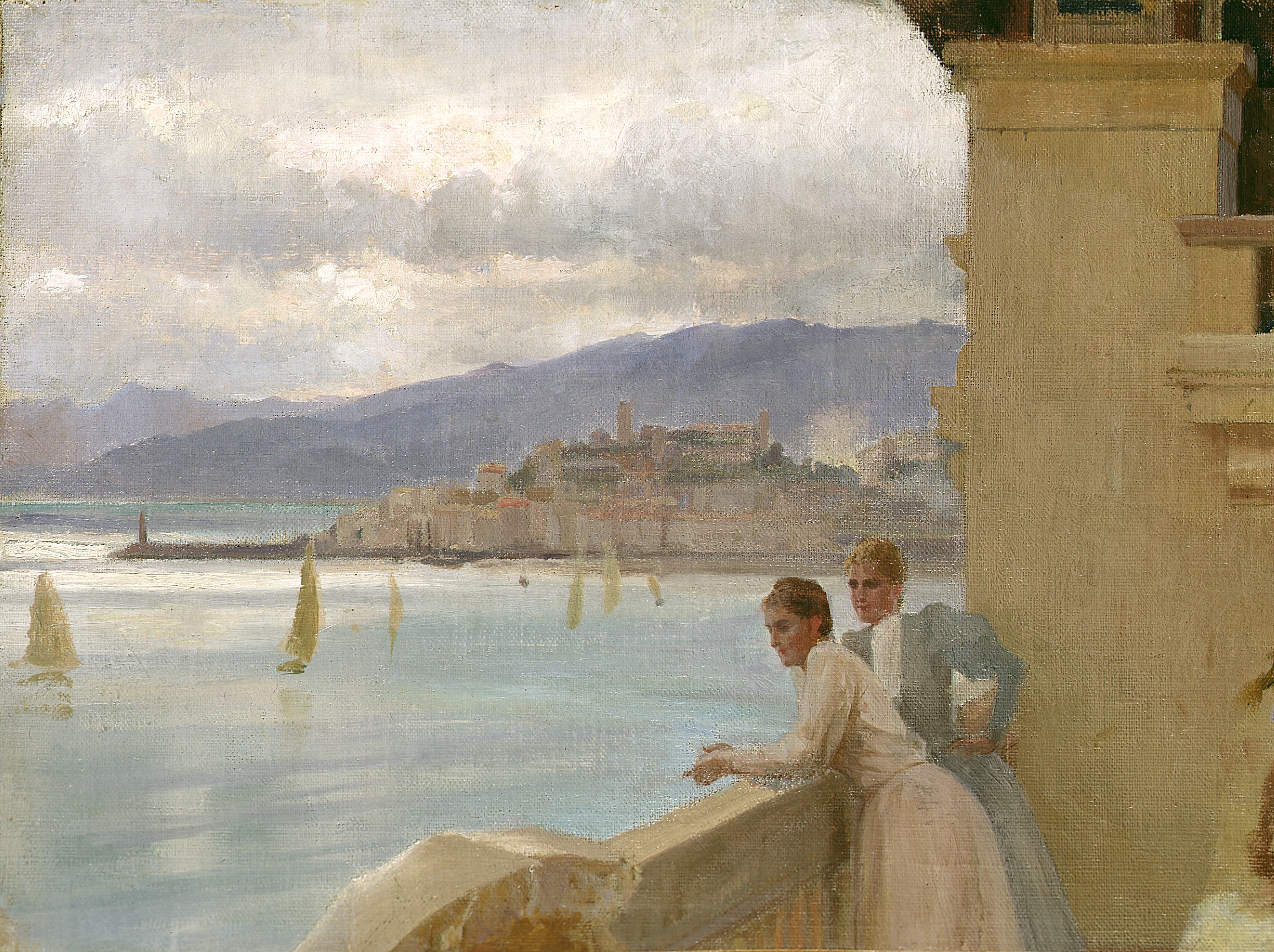 Two women in a balcony looking out into the ocean