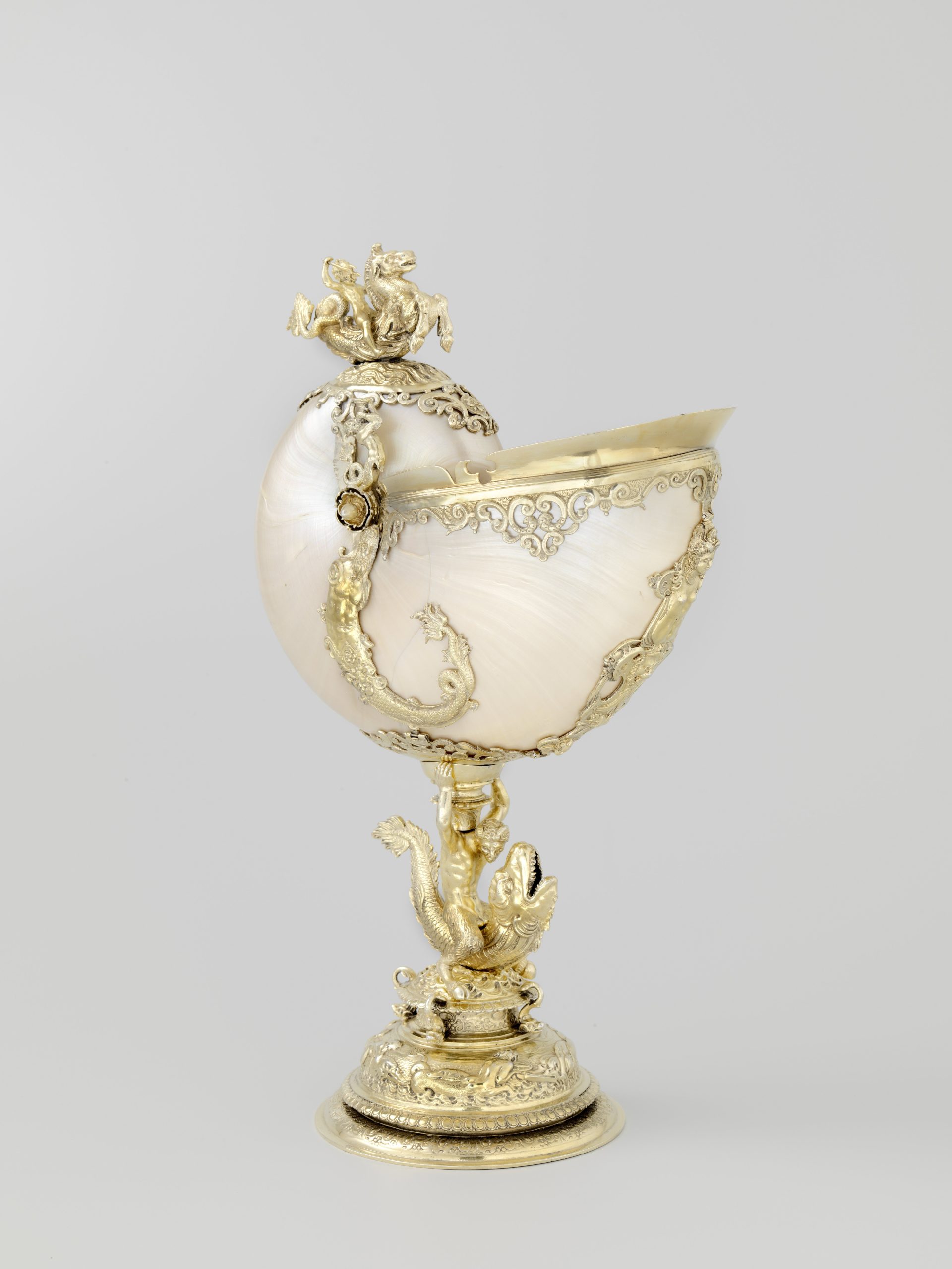 A nautilus cup with gold plated silver frames