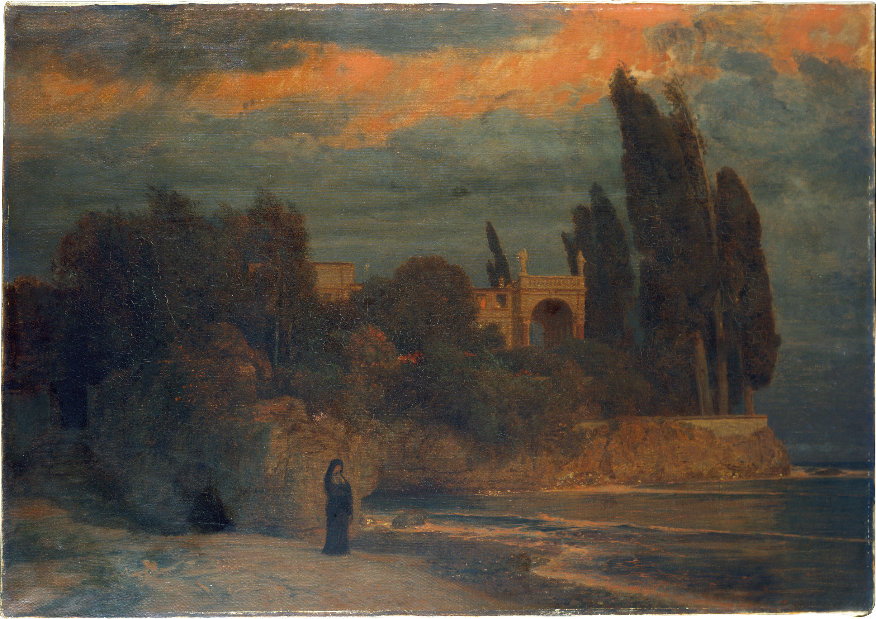 A lone figure standing on a beach with a villa in the background at sundown