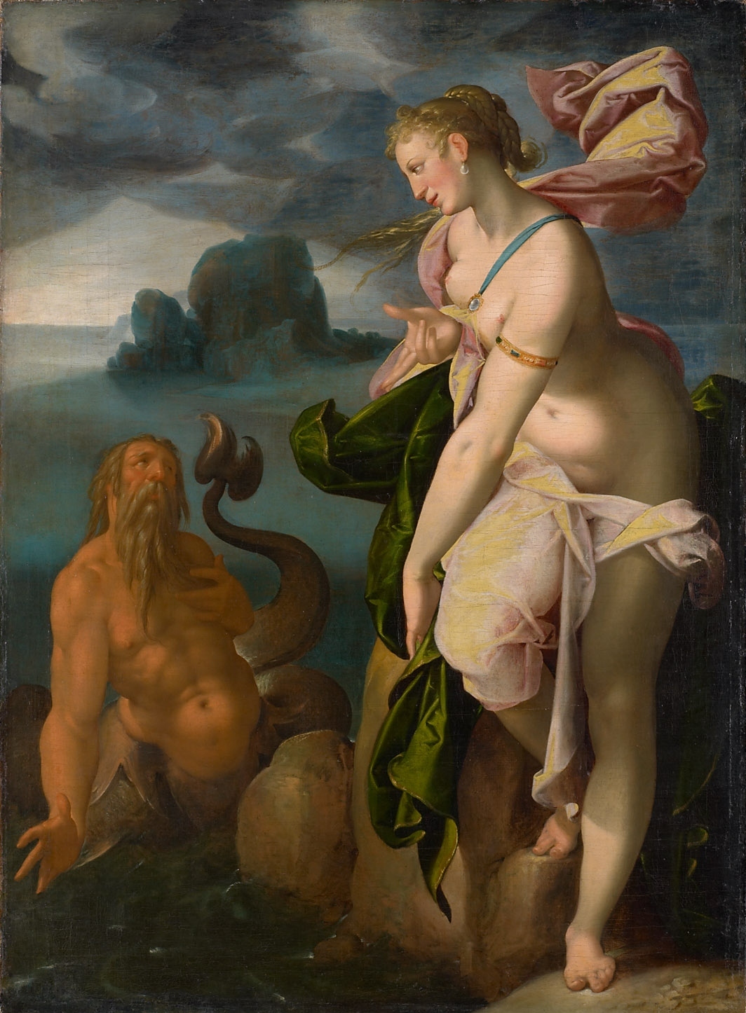 A merman looks up towards a partially nude woman who looks towards him and the sea behind him.