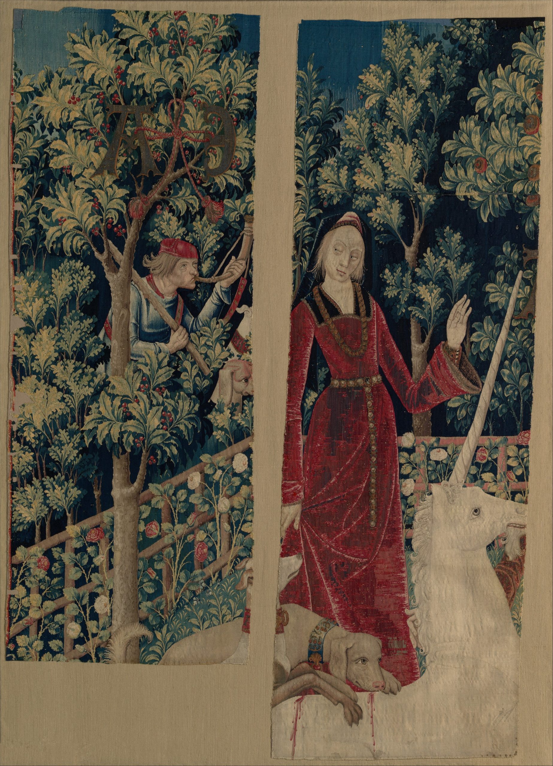 A lady stands with her arm raised next to a unicorn.