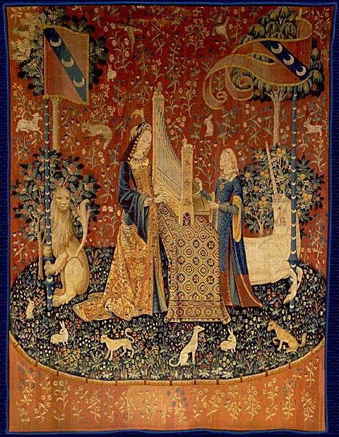 Two women stand facing towards each other with a harp between them and unicorns, lions and flags behind them.