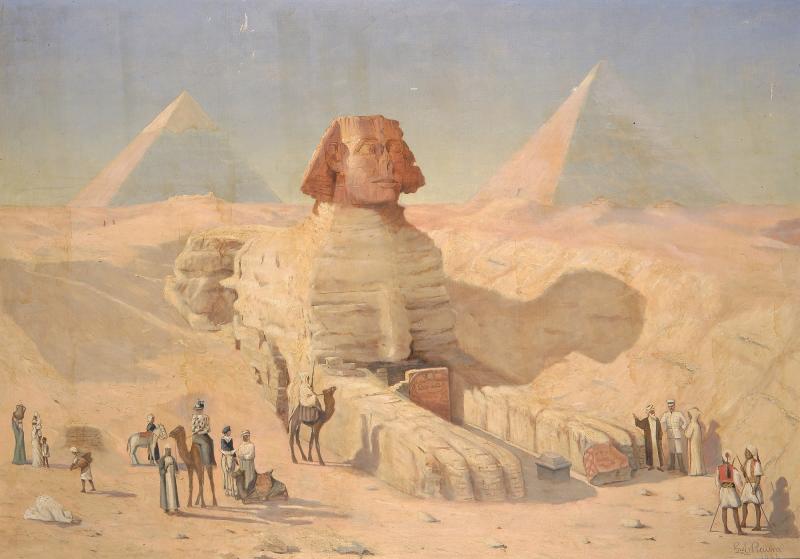 Sphinx statue shown in Egypt. Onlookers and camels are seen in the foreground and pyramids are see in the background.