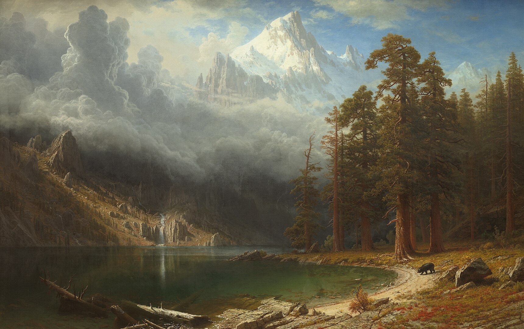 A natural landscape with a forest, mountain, and lake