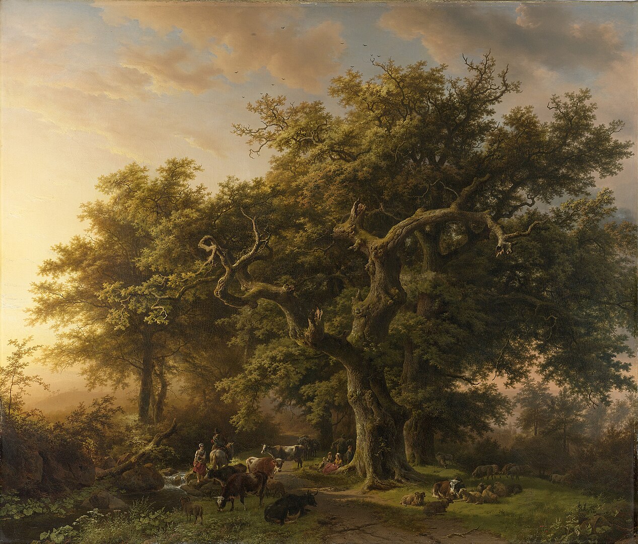 A landscape view of a large tree in a forest with farmers and cattle gathered below