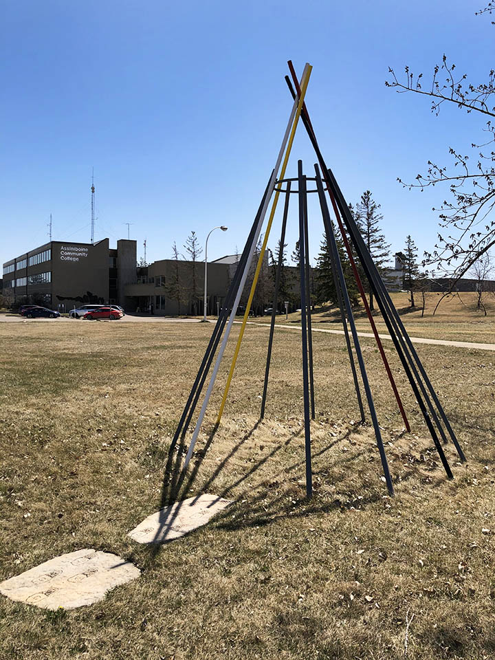 A multi-coloured tipi in front of the Victoria Avenue Campus.