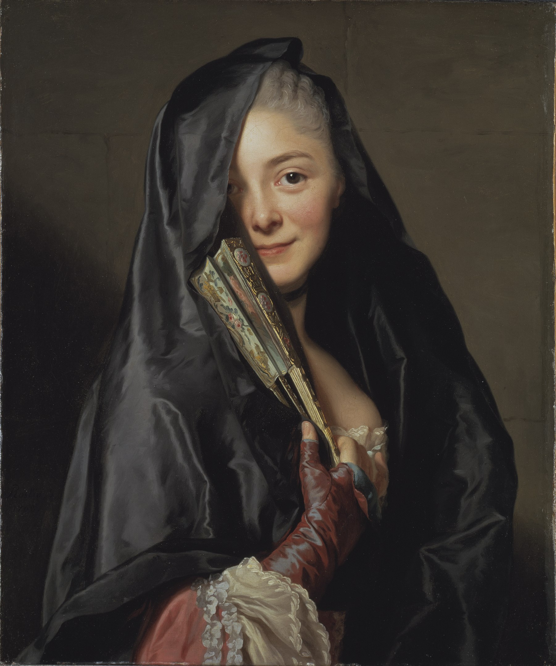 A portrait of a woman posing with a closed fan while her face is half-covered by her veil