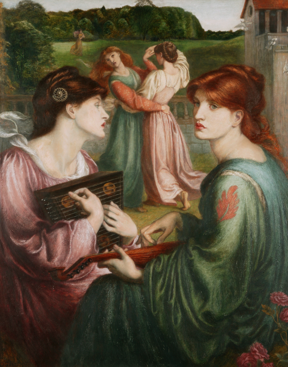 Two women play stringed instruments in the foreground while another two dance hand-in-hand behind them