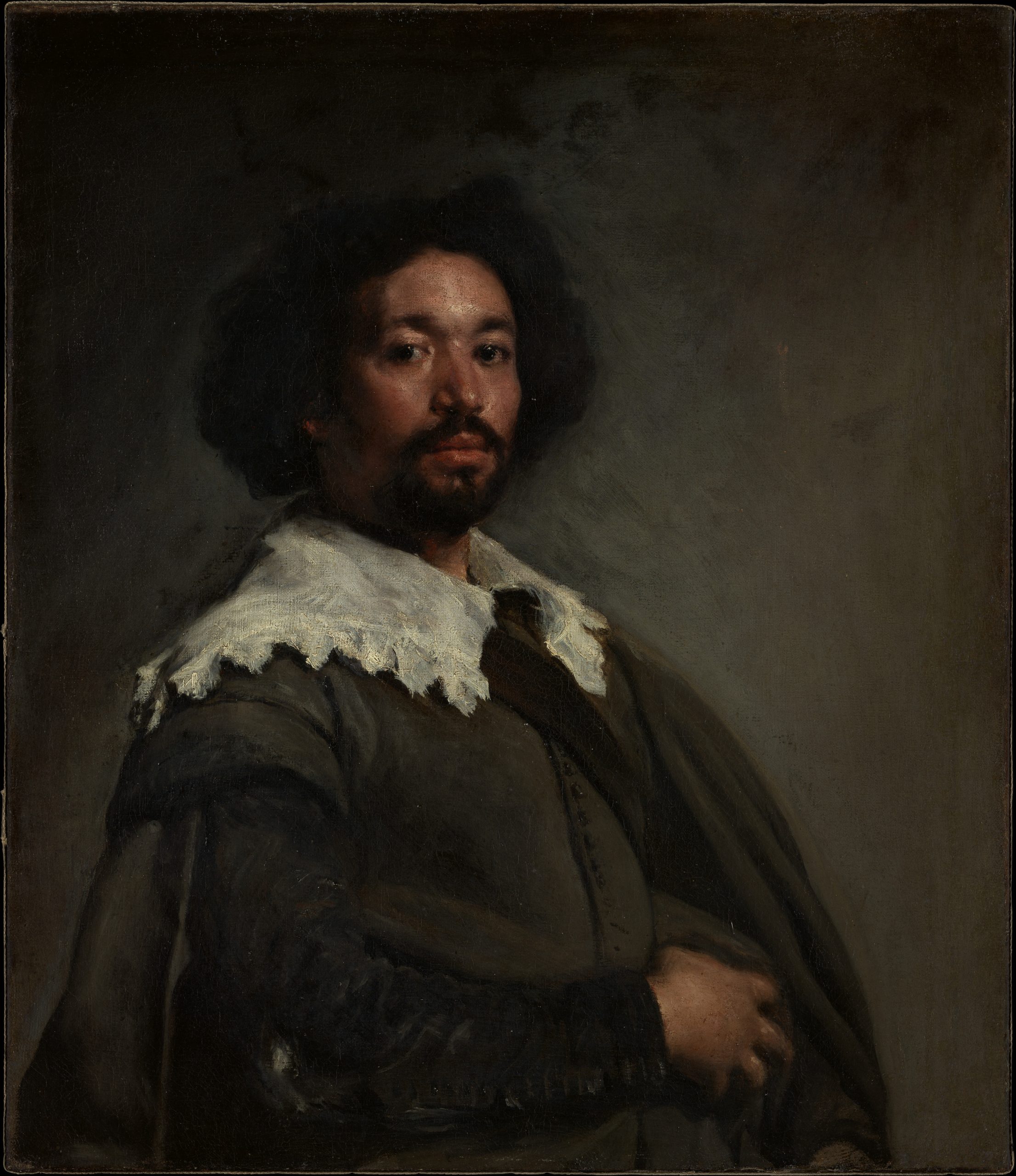 A shadowed portrait of a man.