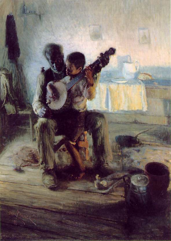 A young boy sits on an older man's lap in a chair as both individuals hold a banjo.