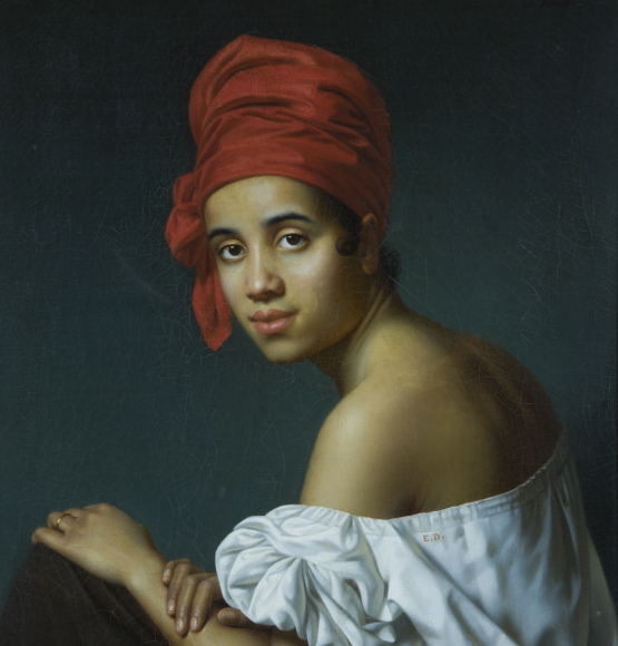 A side profile portrait of a young woman wearing a red turban.