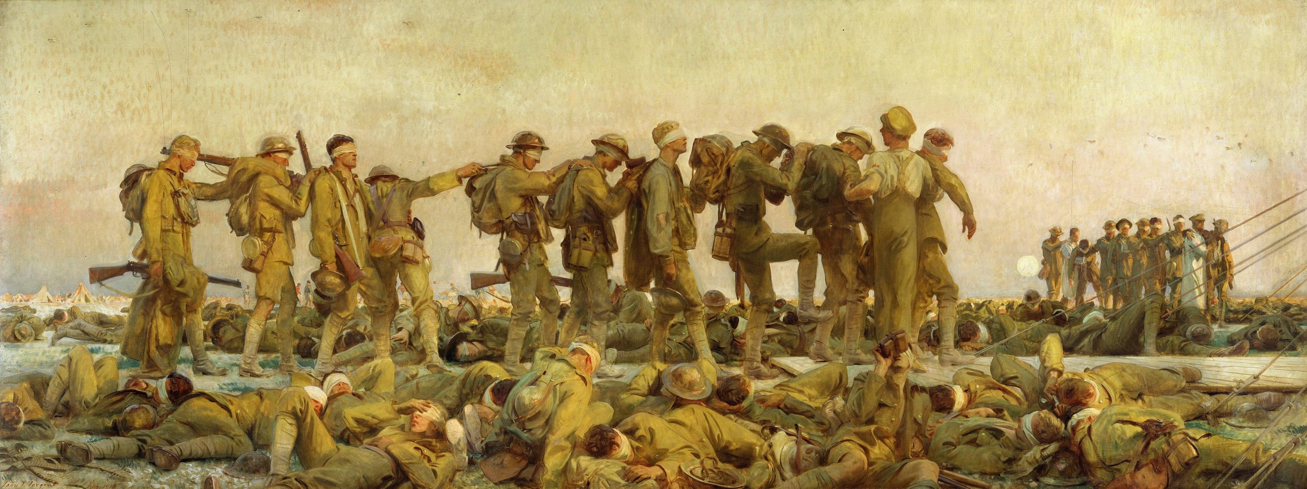 A sideview of a lineup of wounded soldiers trudging along a duckboard while more soldiers lie limp in the foreground and background