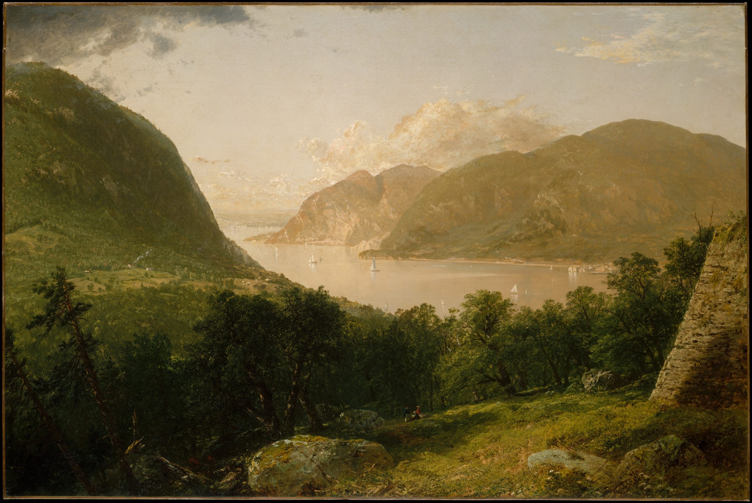 A scene depicting a mountain range full of trees.