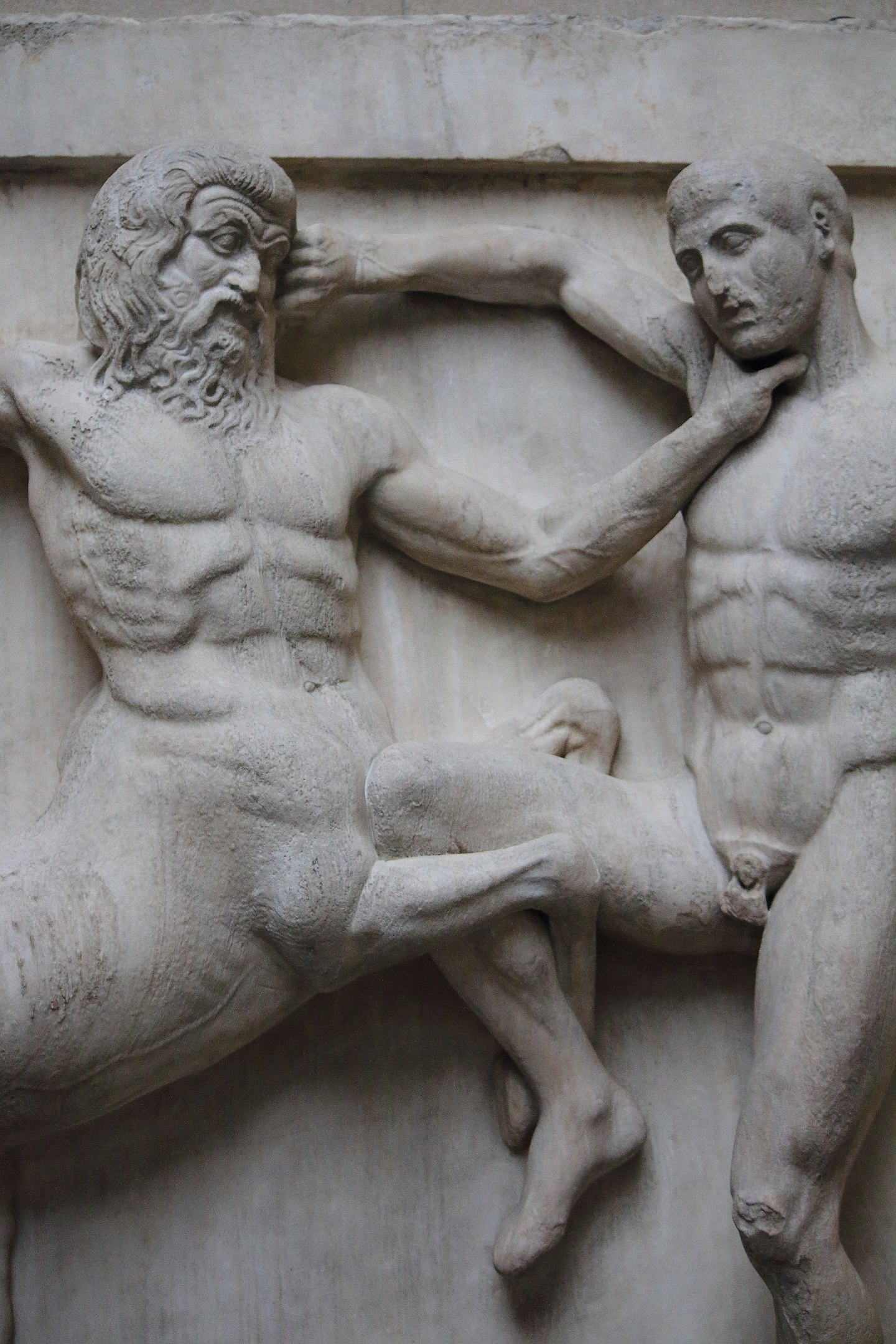 A centaur choking a man and clinging onto him with its front legs