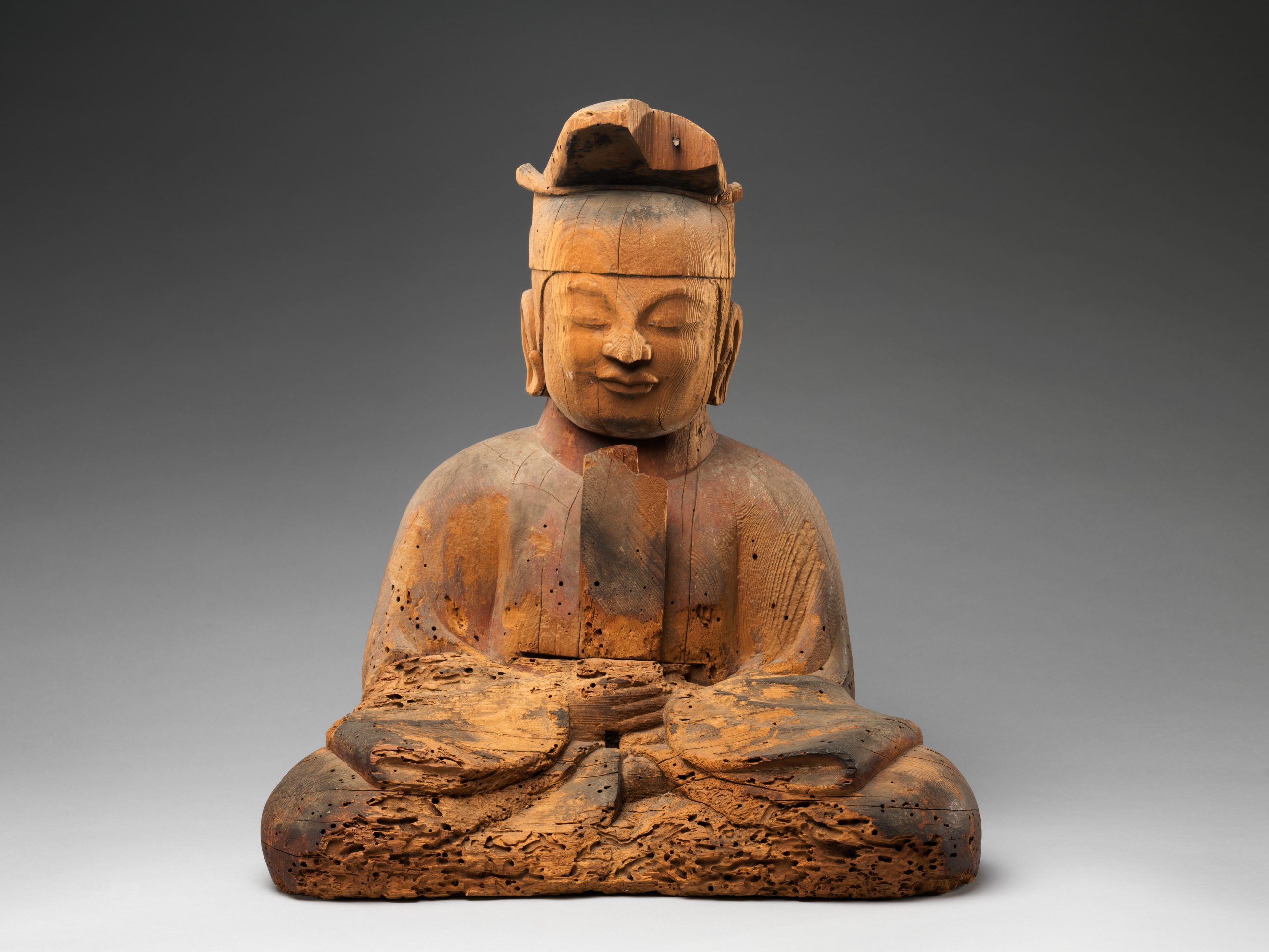A photograph of a sculpture of a buddha from 10th century Japan.