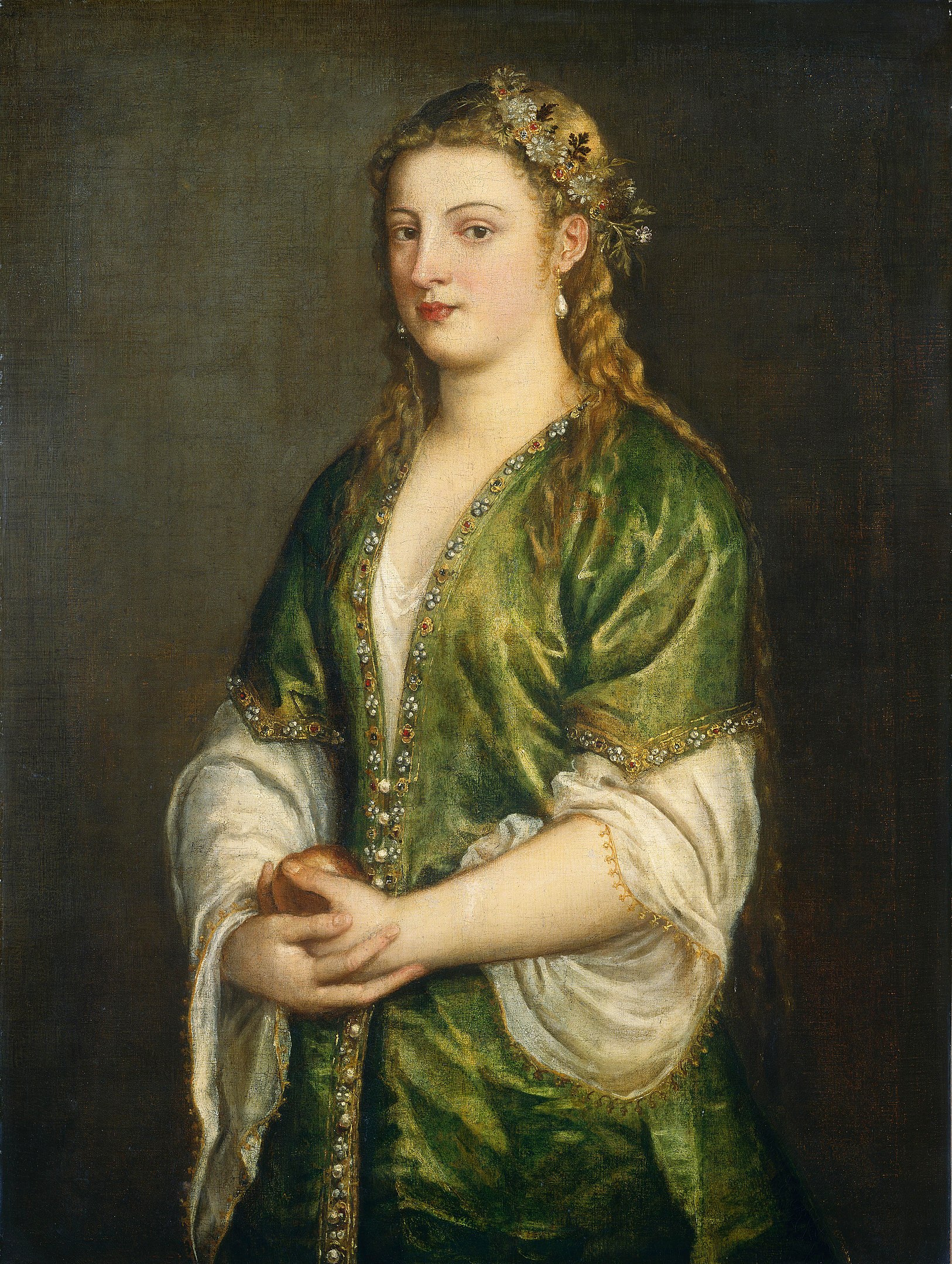 A half-body portrait of a woman holding an apple in her hands