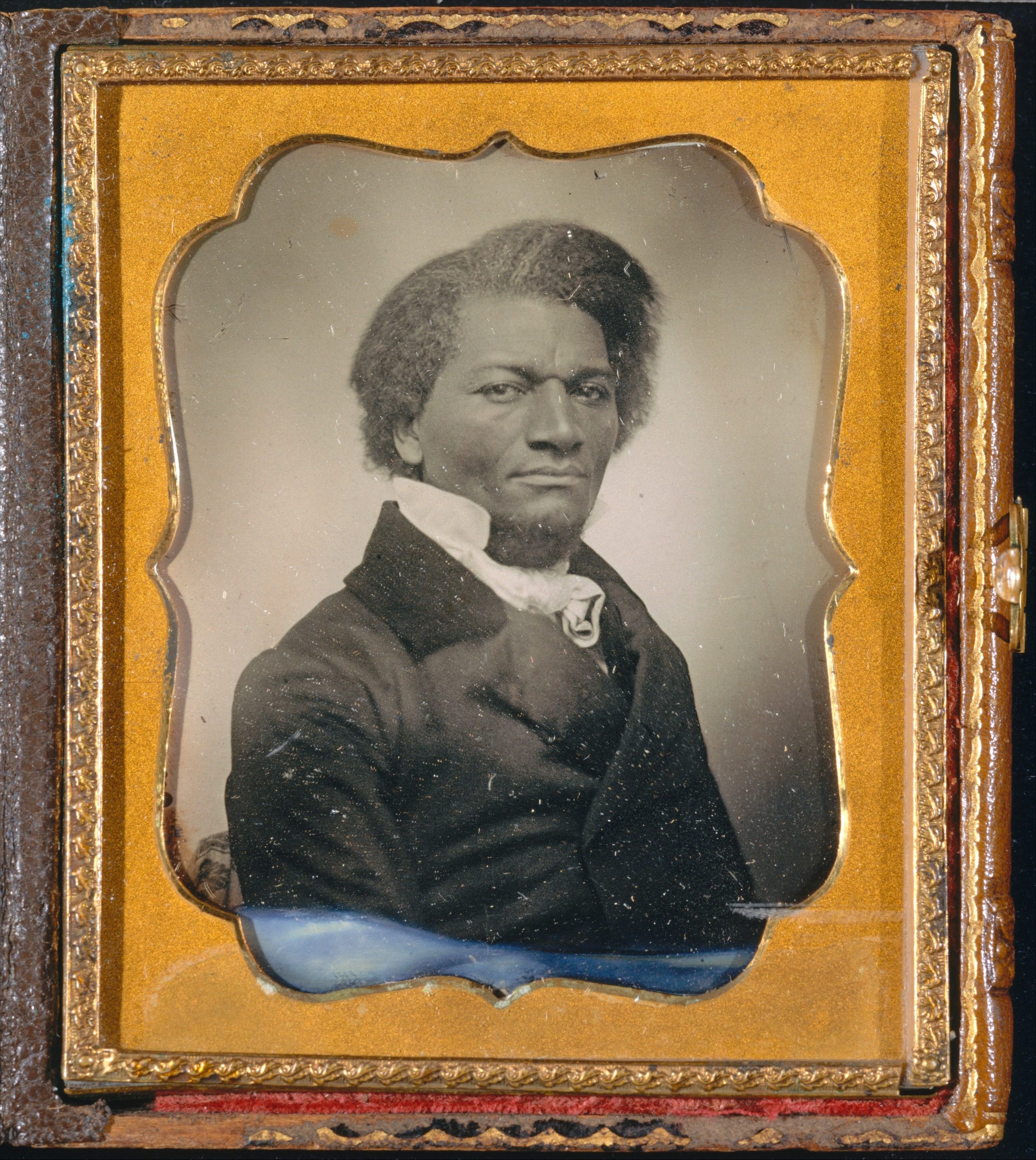 A framed photograph of a portrait of a man.
