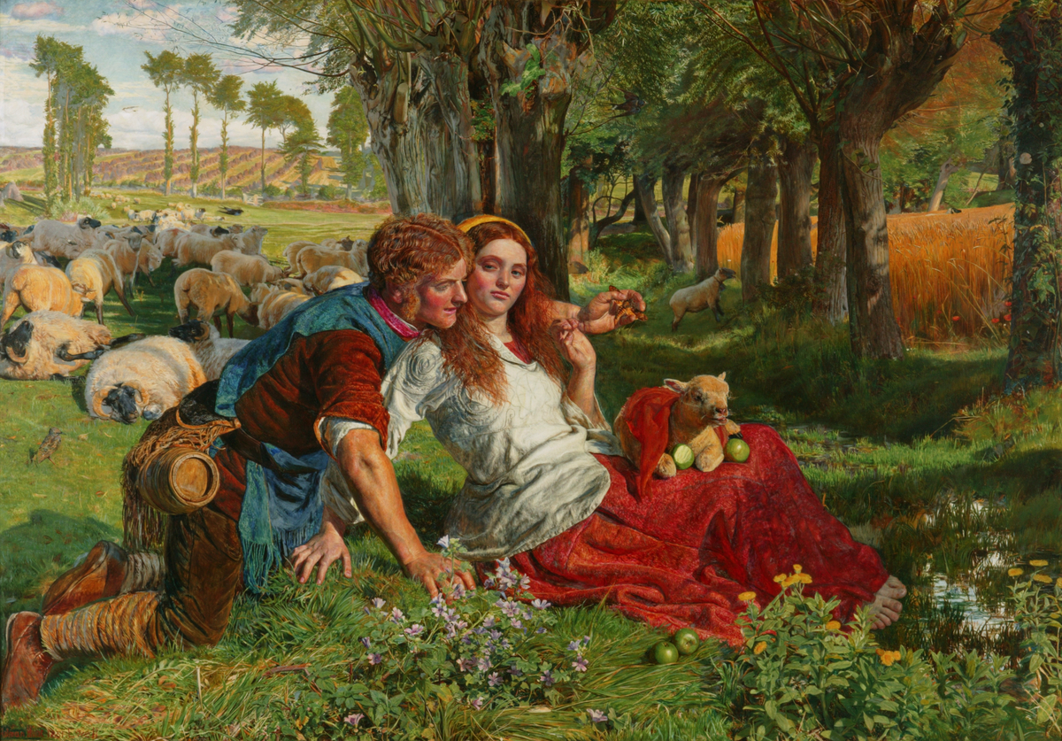 A shepherd seated on a sunny meadow with a country girl as a herd of sheep graze on the field behind them