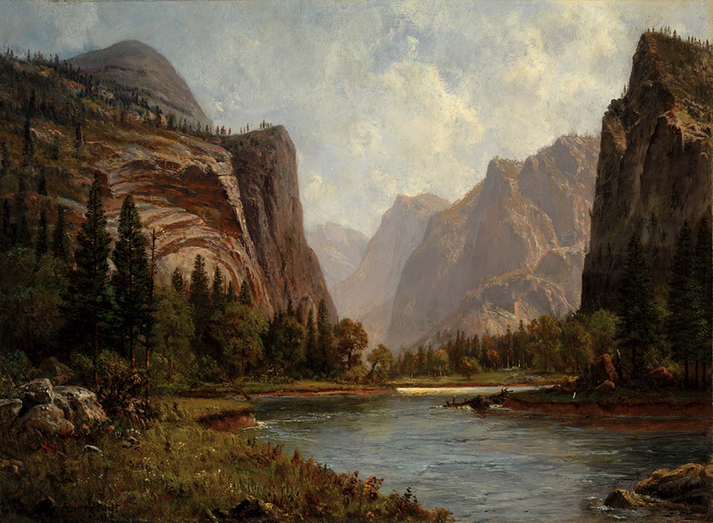 A vista of great mountains overlooking a river