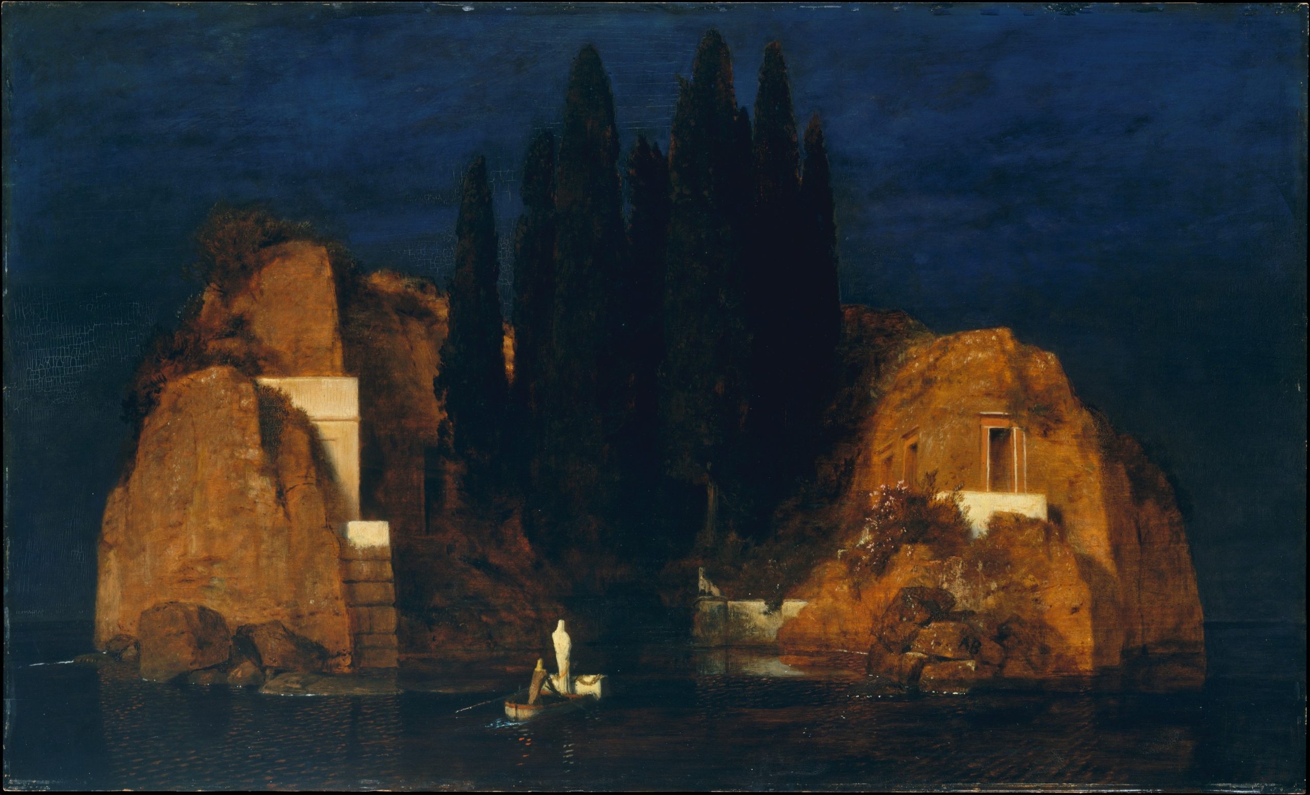 A landscape view of a rocky island with a small boat approaching it at night