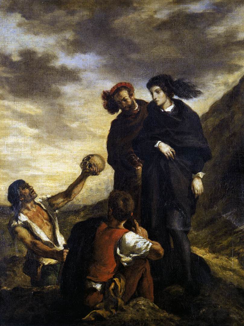 Two men sit next to each other in a rocky landscape while one man holds a skull upwards to the sky as two people stand over them beneath the clouds.