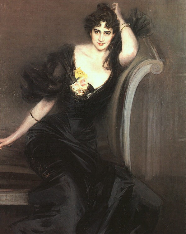 A portrait of a woman staring back at the viewer while sitting on a sofa