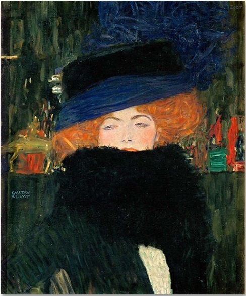 A woman wearing a large hat and feather boa