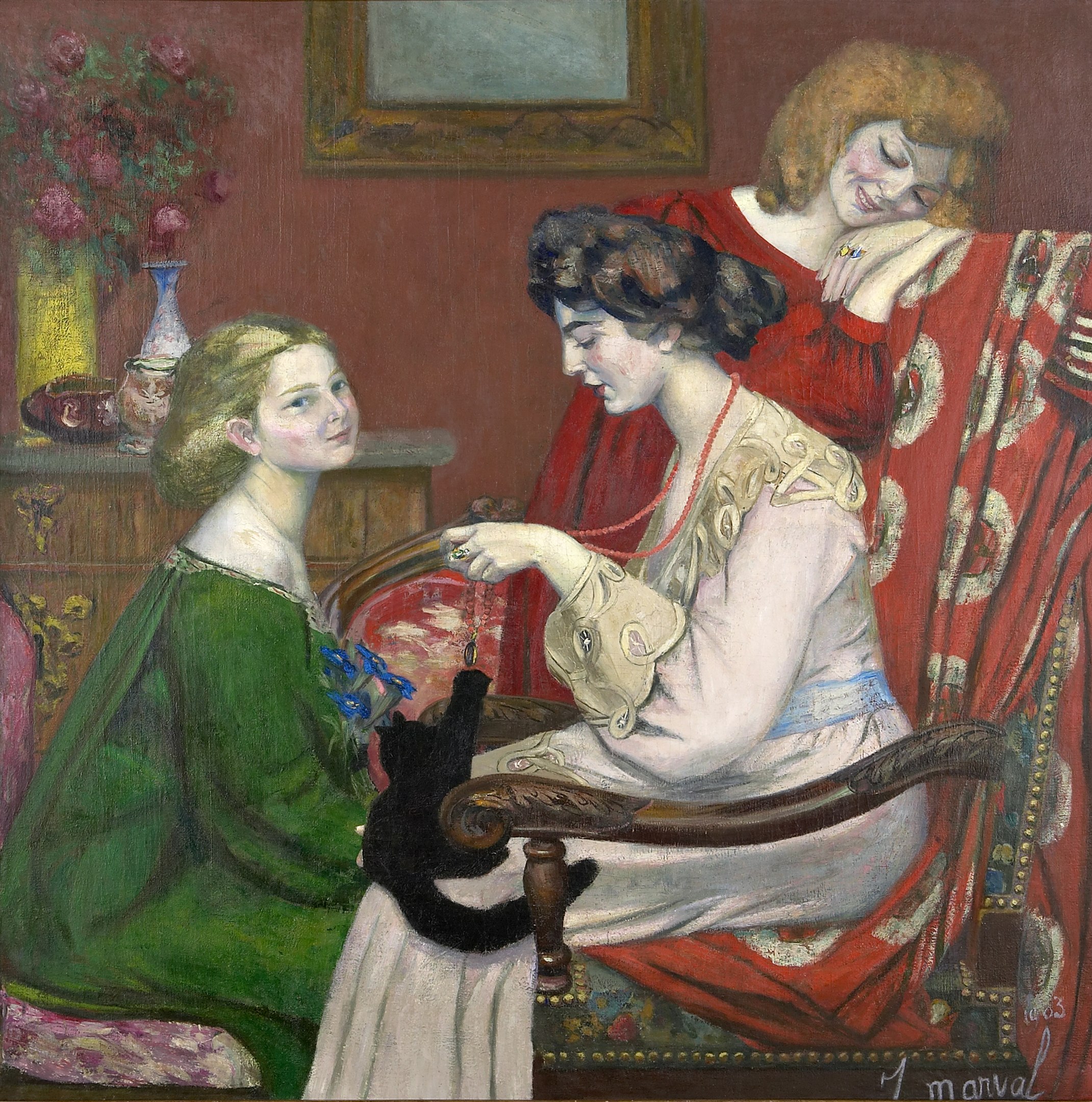 A woman playing with a cat on her lap in a bedroom with two other women beside her