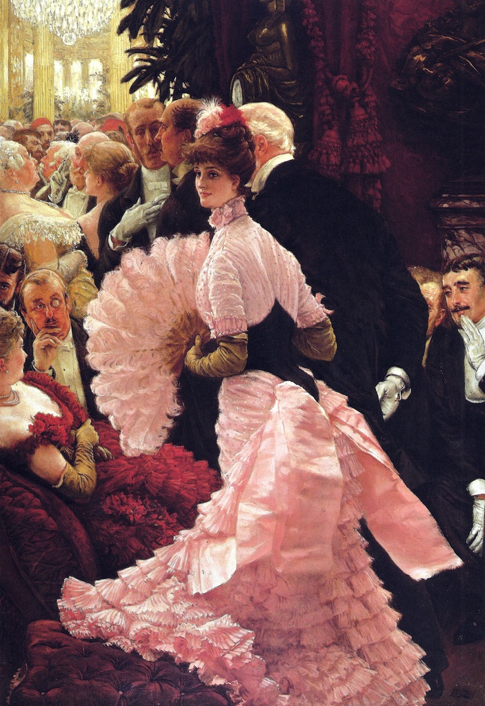 A woman in a gown holding a folding fan amidst a crowd of people at a ball