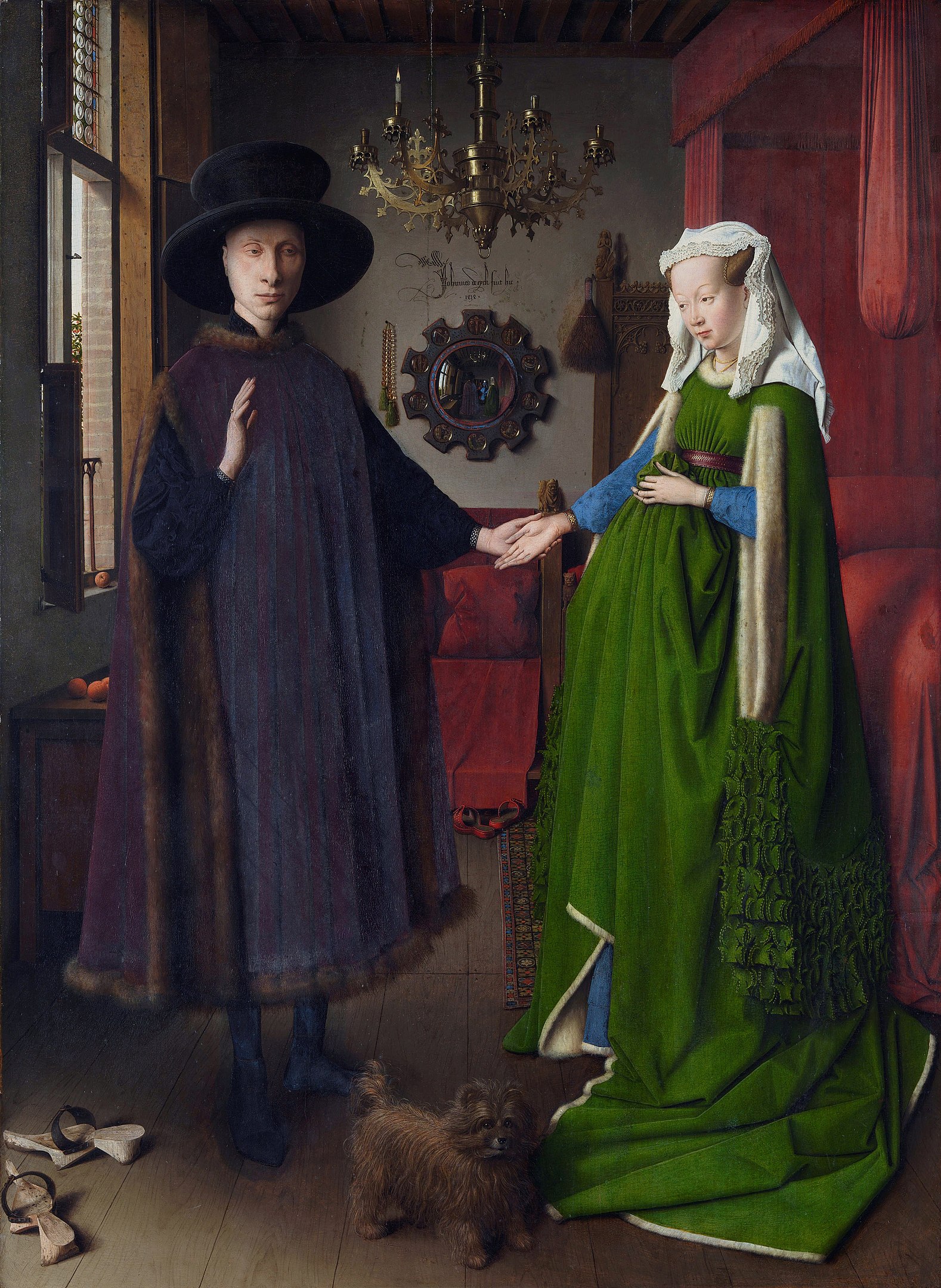 A man and a woman standing hand-in-hand inside a bedroom