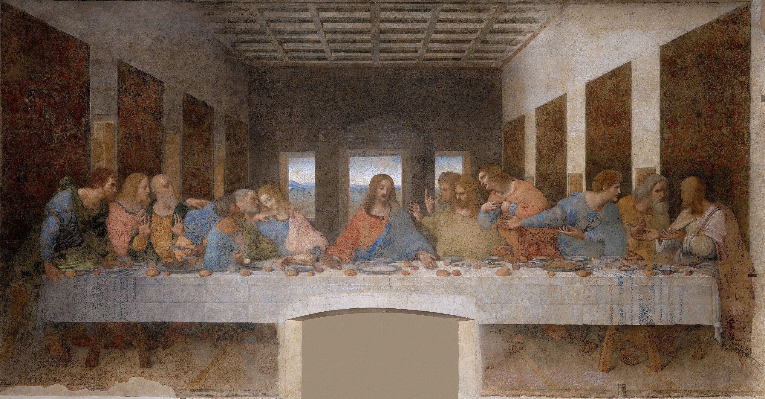 Thirteen spiritual figures sharing a discussion over a meal at a table