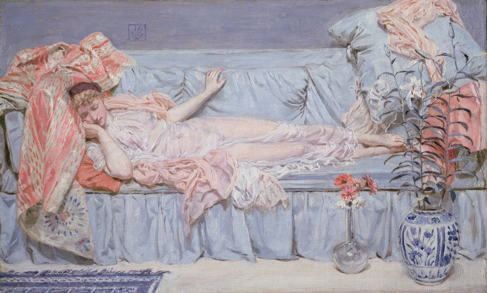 A young woman reclines on a bed of sheets with vases of flowers in front of her.