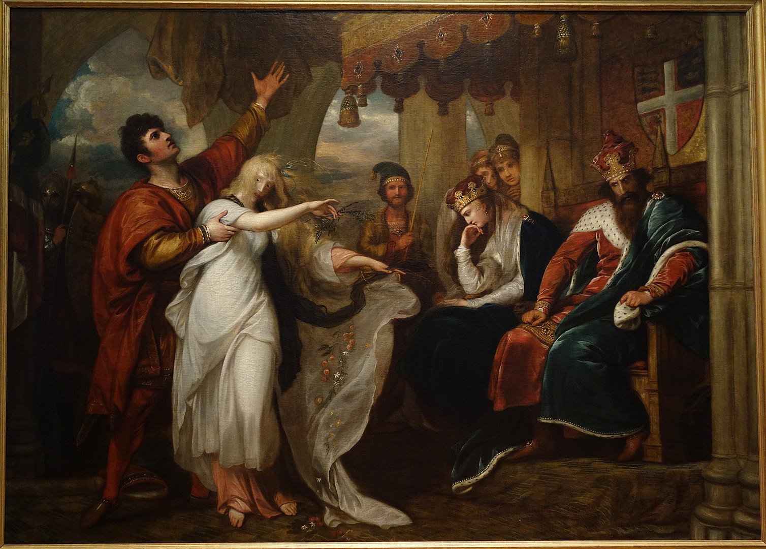 A man carries a young woman who dances while the couple are surrounded by a room of royal figures.
